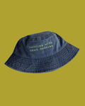 Washed navy bucket hat with lime green embroidered text reading baddies with dead daddies